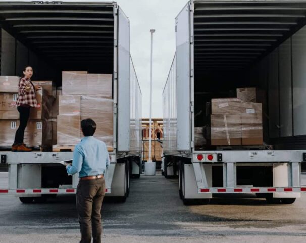 two people unloading truck