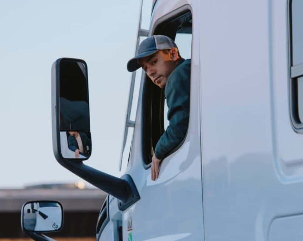 man in truck looking back