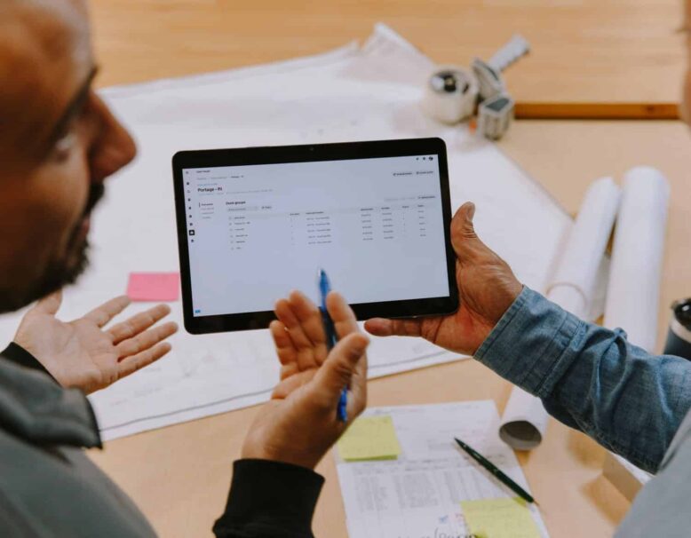 two people discussing ipad