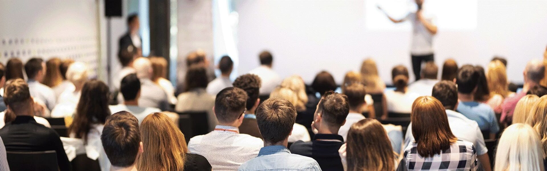 people listening at a conference